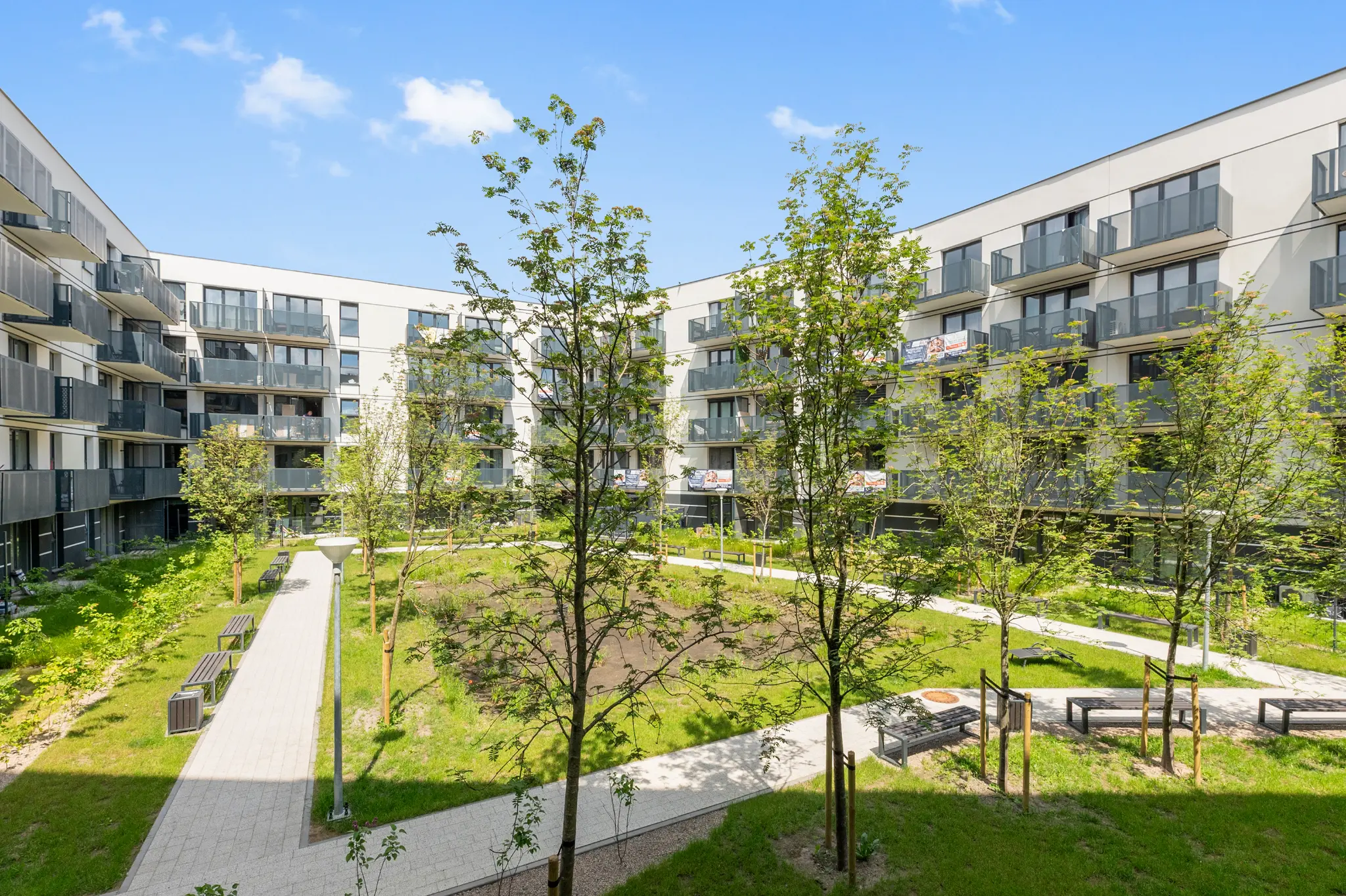 Murapol Portovo buildings and a green courtyard on Mostek Street in Gdańsk