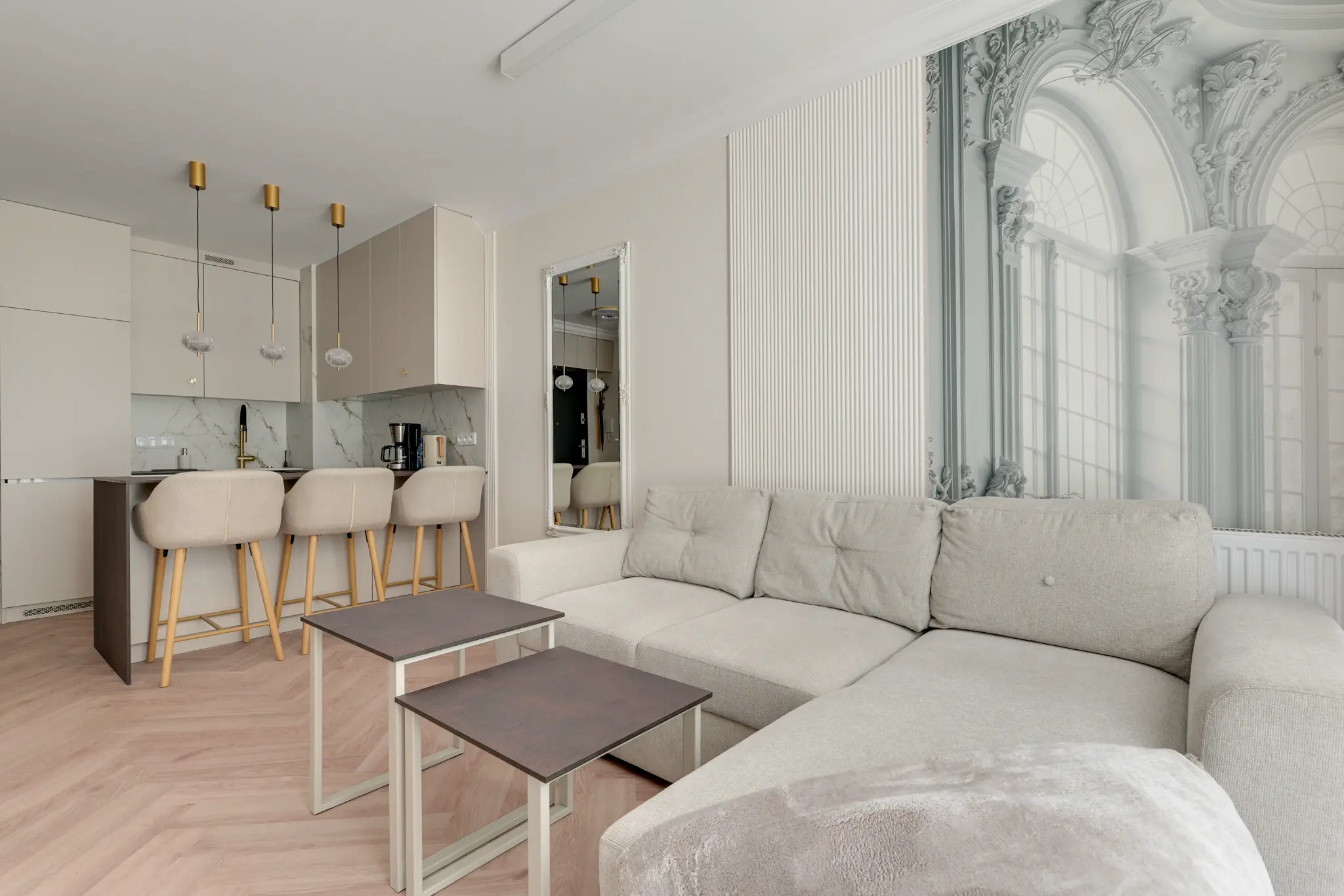 Bright living room with a corner sofa, TV and kitchen in Murapol Portovo