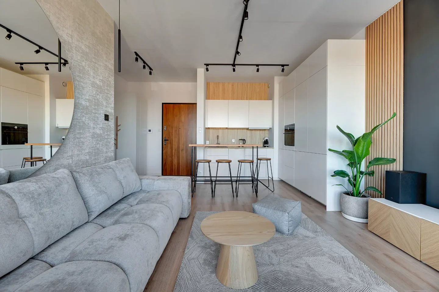 Living room with a kitchenette in an apartment in Brabank managed by GrandRent.